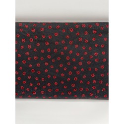 TISSU SPIRALES ROUGES SUR FOND NOIR